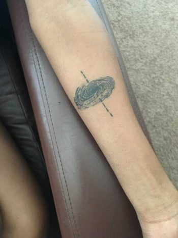 Black hole tattoo by Chris Adkins