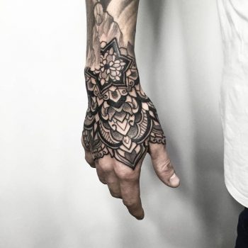Black ornamental tattoo on the right hand