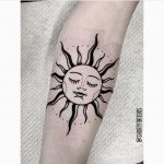 Black sun tattoo by Ana