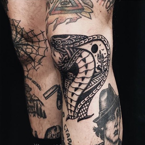 Blackwork cobra tattoo