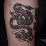 Blackwork dragon tattoo