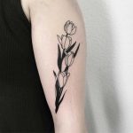 Blackwork four tulips tattoo
