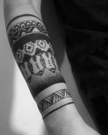 Blackwork pattern tattoo on the forearm