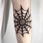 Blackwork spider web tattoo