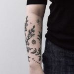 Botanical tattoos on the right arm
