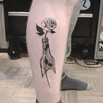 Broken bottle and rose tattoo
