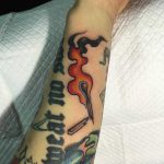 Broken burning match tattoo