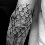 Broken fence tattoo on the elbow