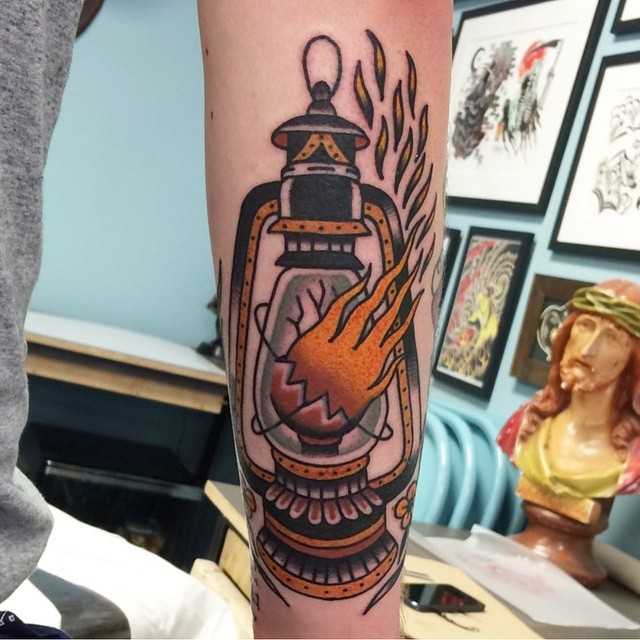 Broken lantern tattoo by Chris Collins