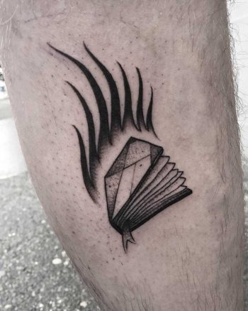 Burning book tattoo