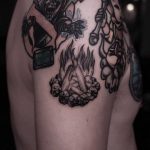 Campfire tattoo on the right shoulder