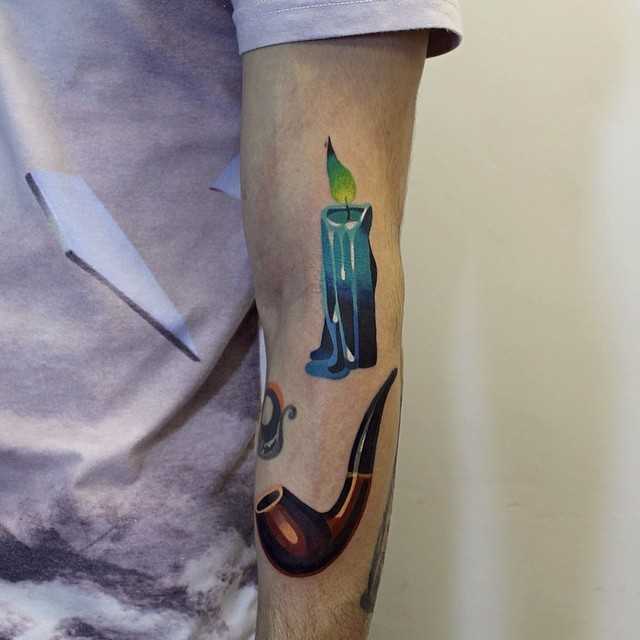 Candle and pipe tattoos