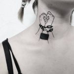 Chained hands tattoo