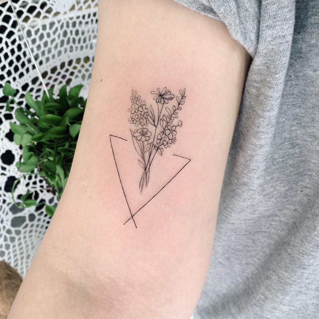 Child’s birthmark flower bouquet tattoo