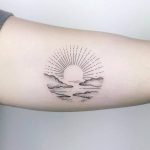 Circular sunset tattoo