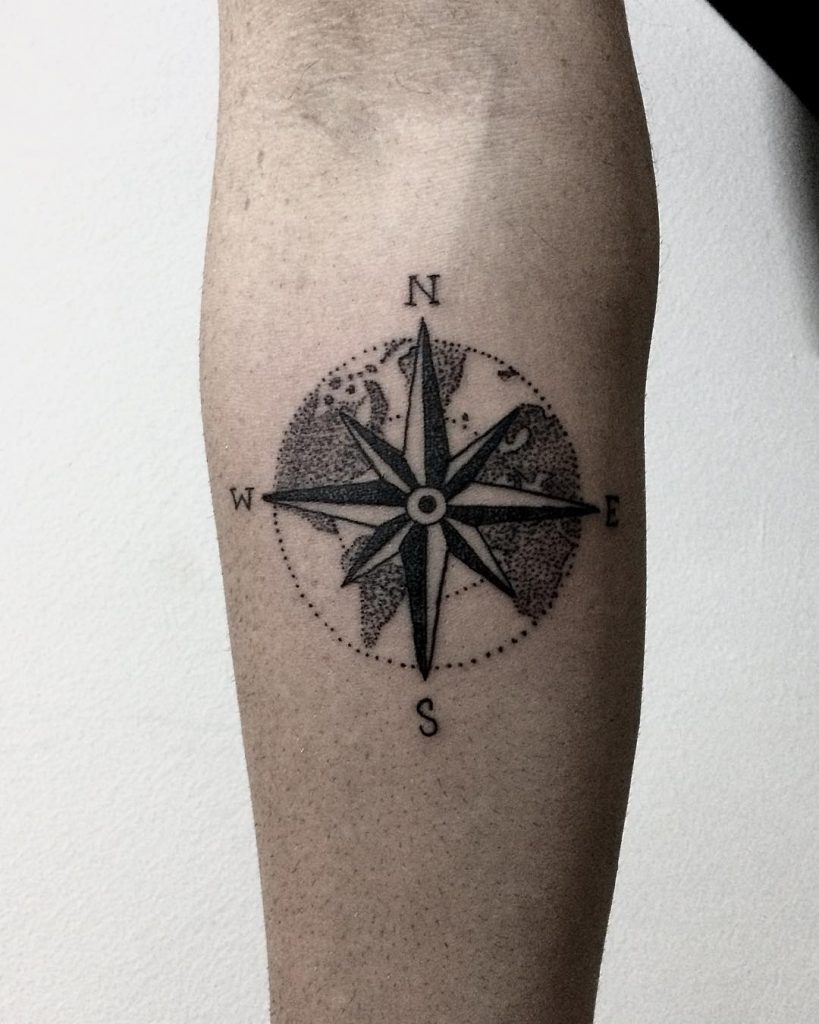 Circular world map and compass rose tattoo