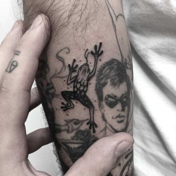 Climbing frog tattoo