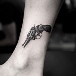 Cover up revolver tattoo by Calvin Grxsy