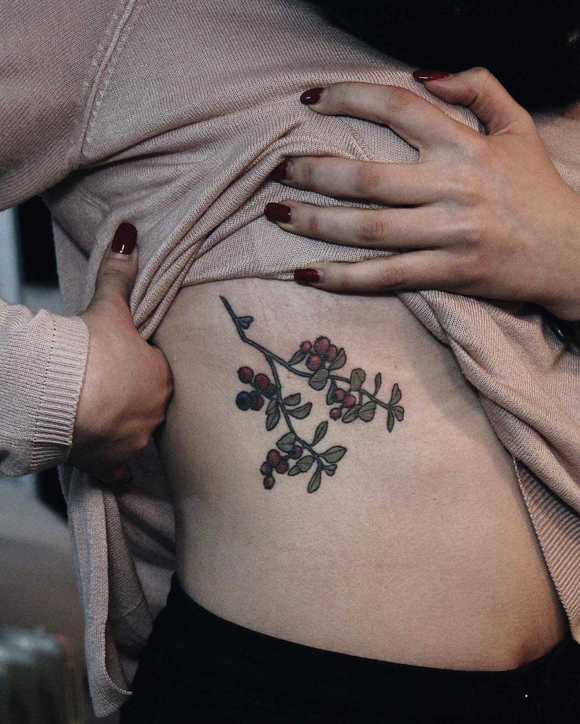 Cranberries tattoo on the rib cage