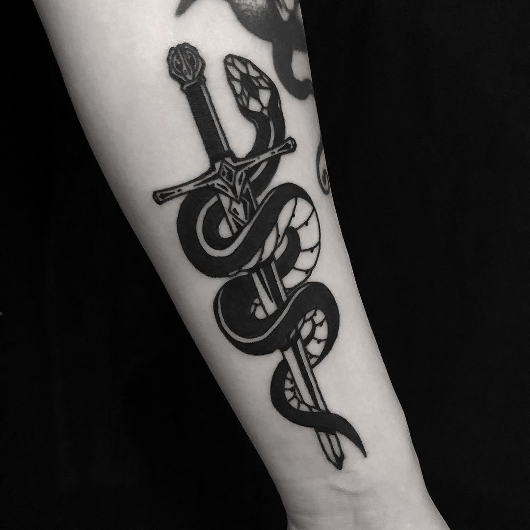 Crawling snake and sword tattoo 