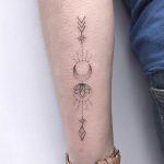 Custom arrow, flower, and moon tattoo