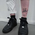 Cute cat tattoo on the shin