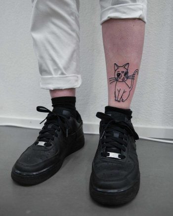 Cute cat tattoo on the shin