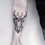 Deer skull and snake tattoo