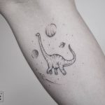 Dinosaur and planets tattoo by pablo torre