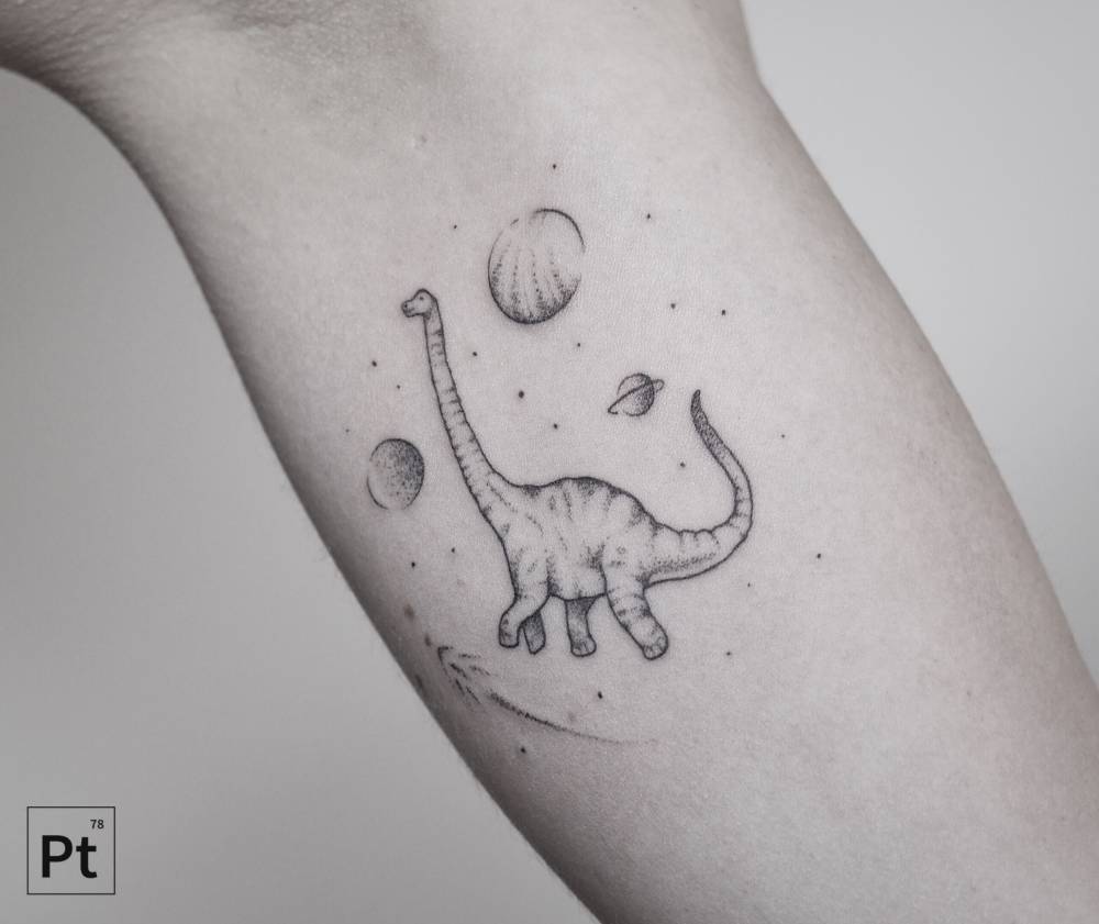 Dinosaur and planets tattoo by pablo torre
