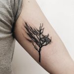Disappearing tree tattoo