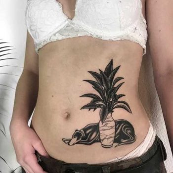 Dog and flowers tattoo by Dirty Randy