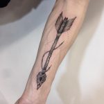 Dot-work style arrow tattoo