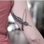 Feather and knife tattoo by Jonas Ribeiro