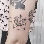 Floral letter tattoo