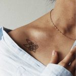 Flower tattoo on the collarbone by kalula