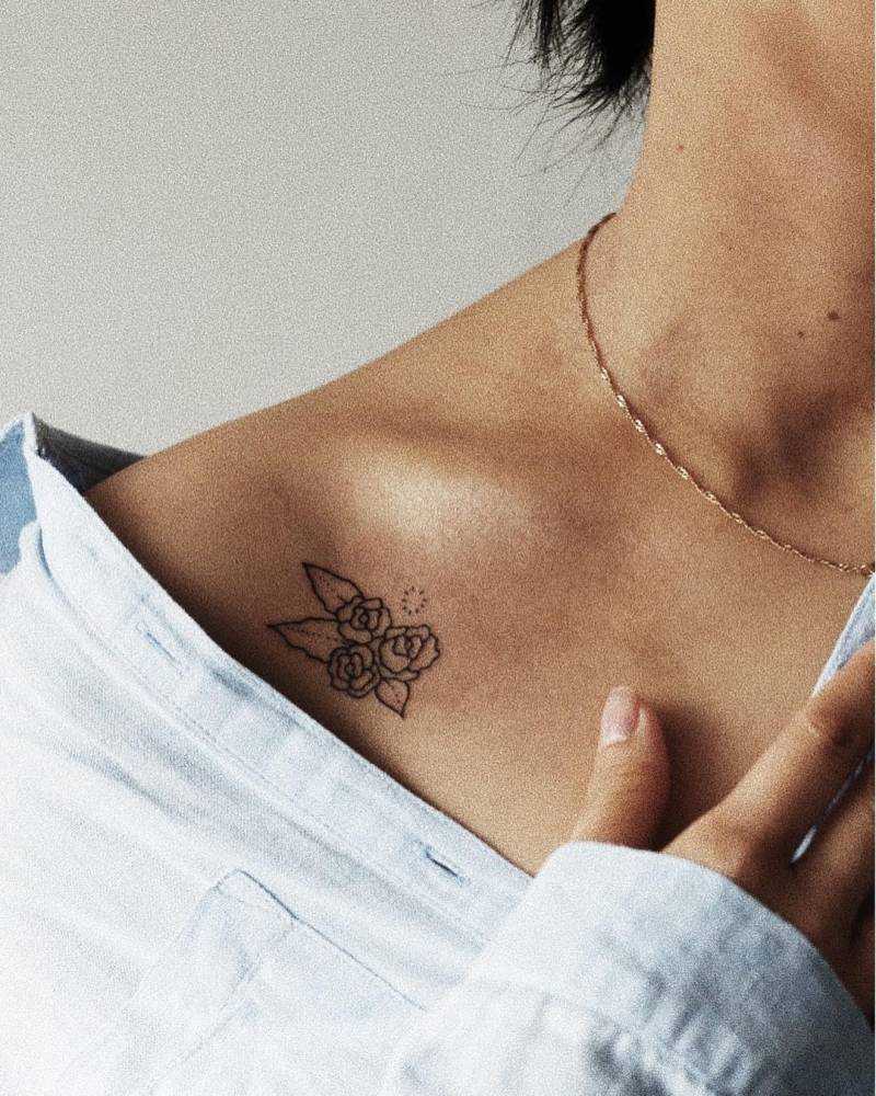 Flower tattoo on the collarbone by kalula