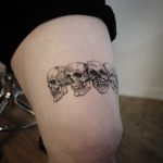 Four skulls on the thigh