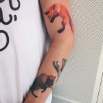 Fox and bison tattoo