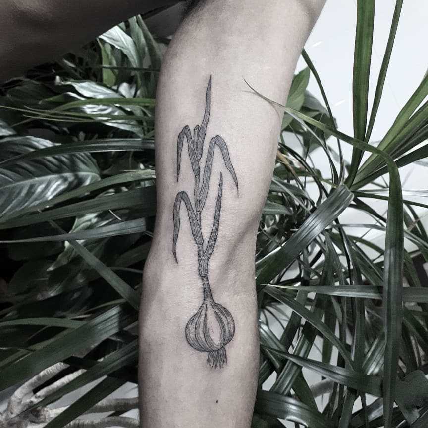 Garlic tattoo on the arm