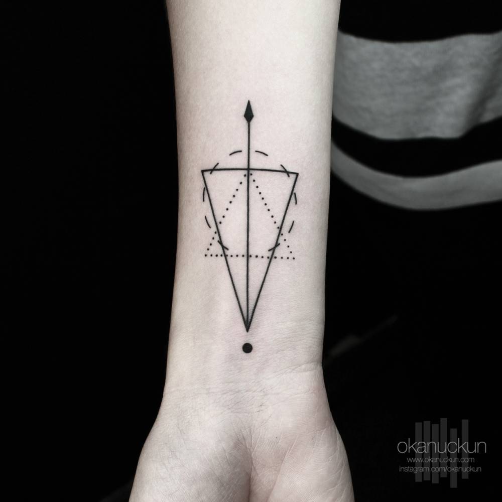 Geometric shield and arrow tattoo