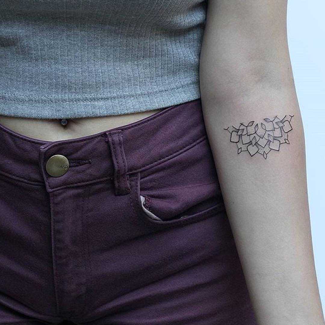 Half mandala tattoo by Lindsay April