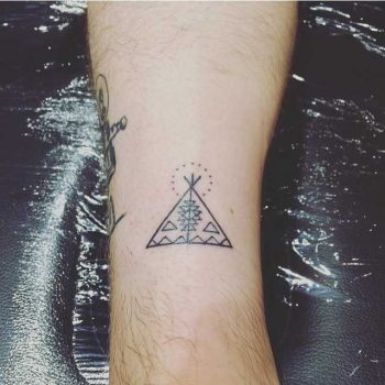 Hand-poked Tipi tattoo