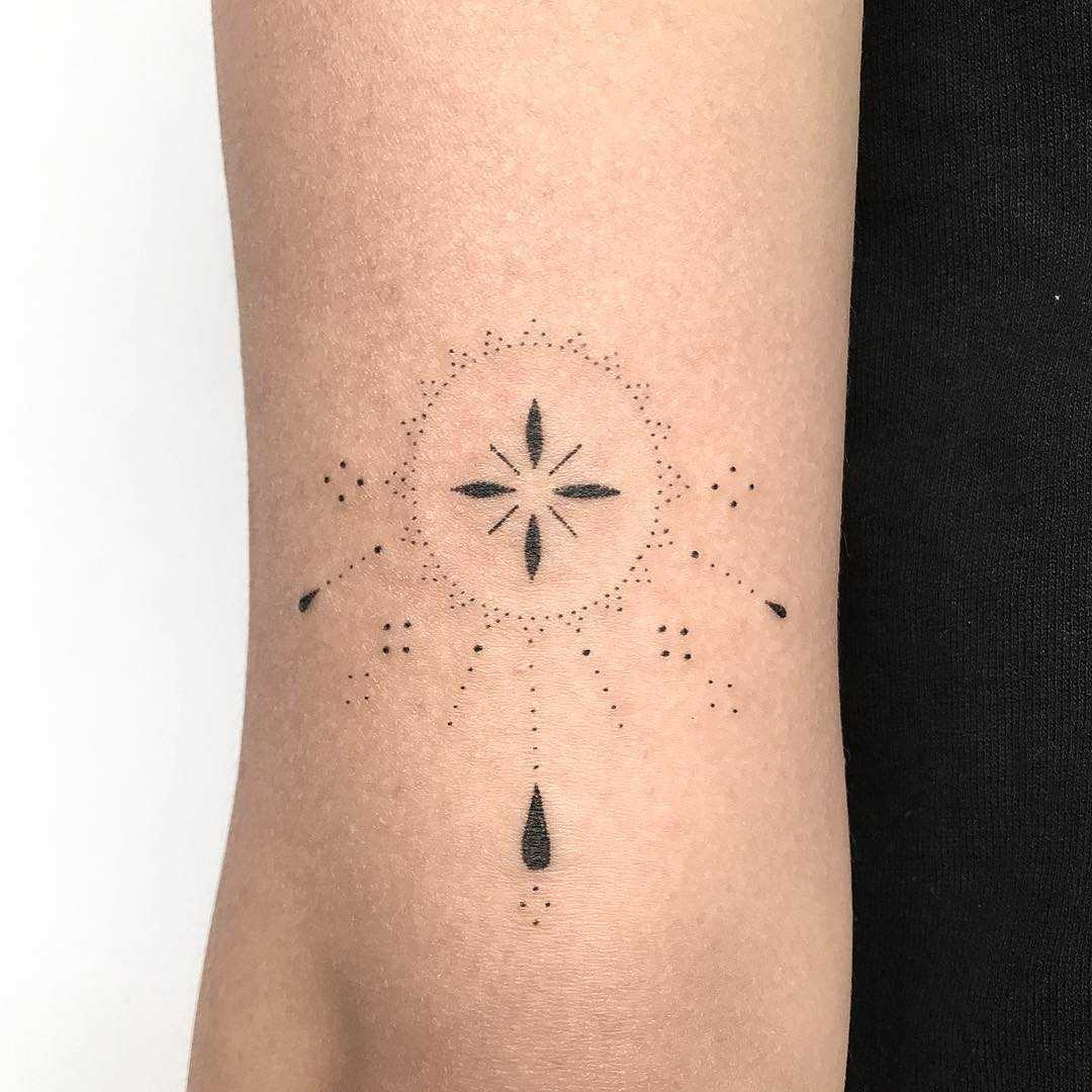Hand-poked custom tattoo on the forearm