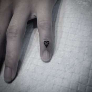 Hand-poked heart tattoo by Hurricane