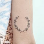 Hand-poked laurel wreath tattoo