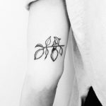 Hand-poked lemon branch tattoo