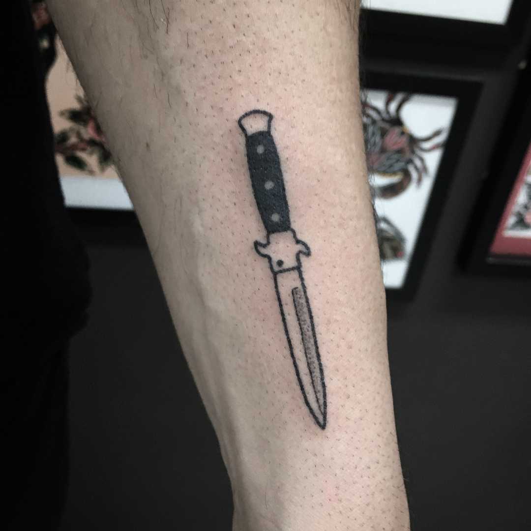 Hand-poked little knife tattoo