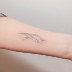 Hand-poked mountain range tattoo by Nano Ponto