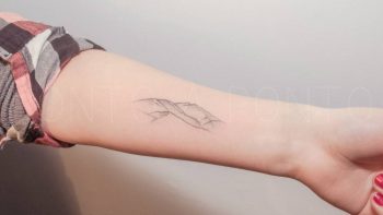 Hand-poked mountain range tattoo by Nano Ponto
